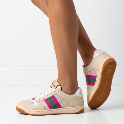 Beige Gucci low-top sneaker with pink and green web stripe and gum sole