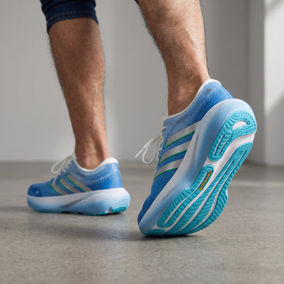 blue adidas running shoes with white midsole and aqua outsole
