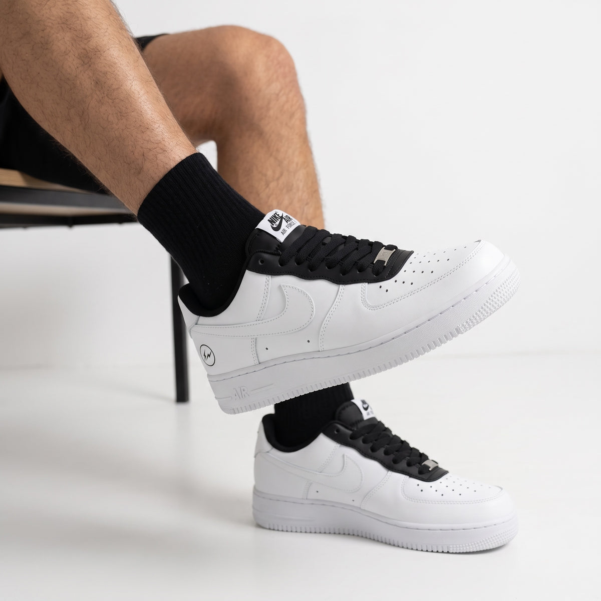 Nike Air Force 1 Low white sneaker with black tongue and AF1 charm
