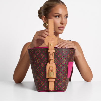 Louis Vuitton brown monogram bucket bag with pink perforations and natural leather handle