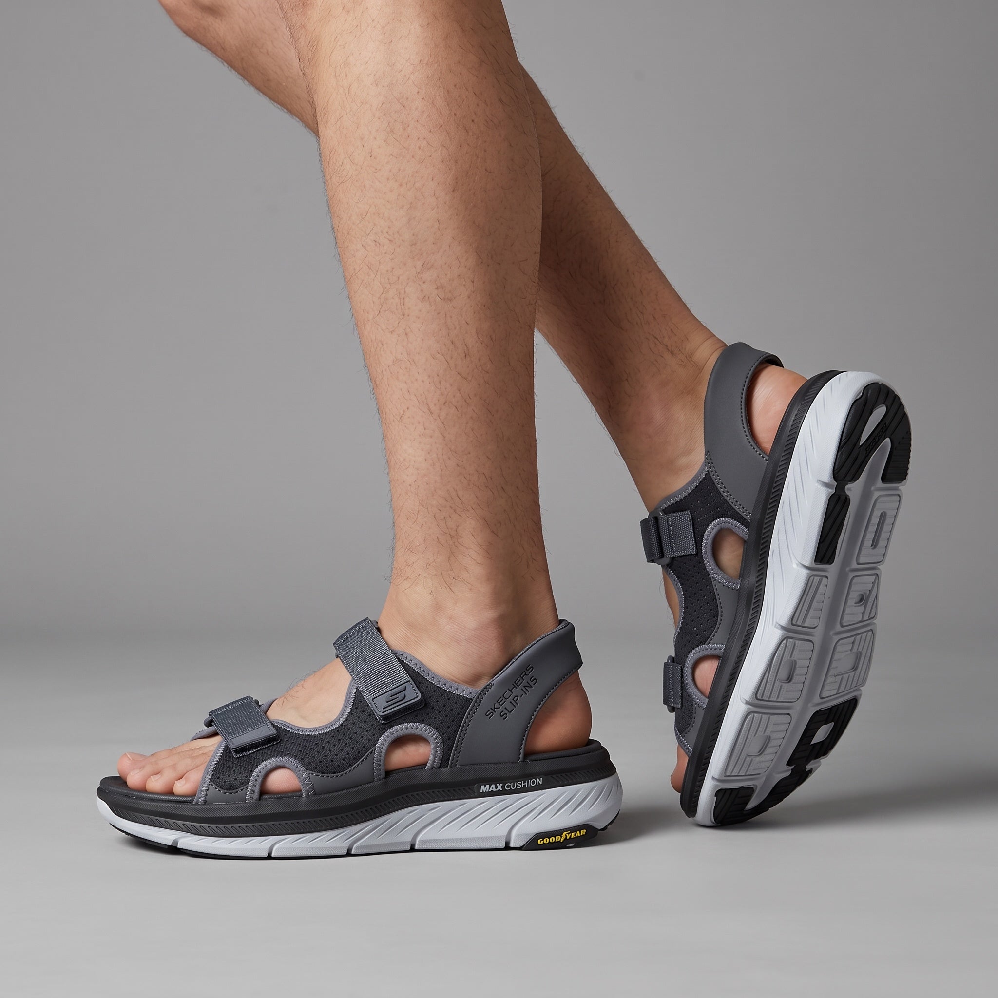 grey Skechers men's sandal with thick white sole and adjustable straps