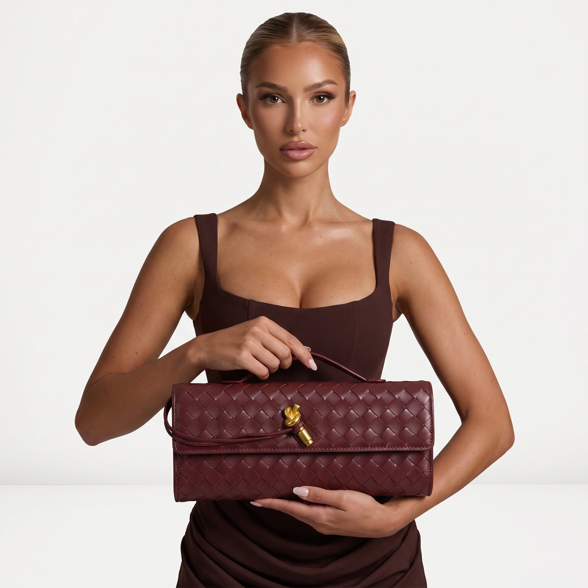 Burgundy woven-effect Bottega Veneta satchel with top handle and gold knot hardware