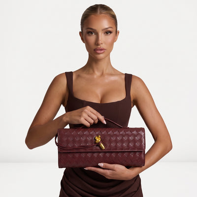 Burgundy woven-effect Bottega Veneta satchel with top handle and gold knot hardware
