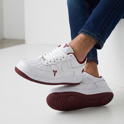White low-top Nike Air Force 1 with burgundy accents, textured upper, Kobe logo and number 33 on heel