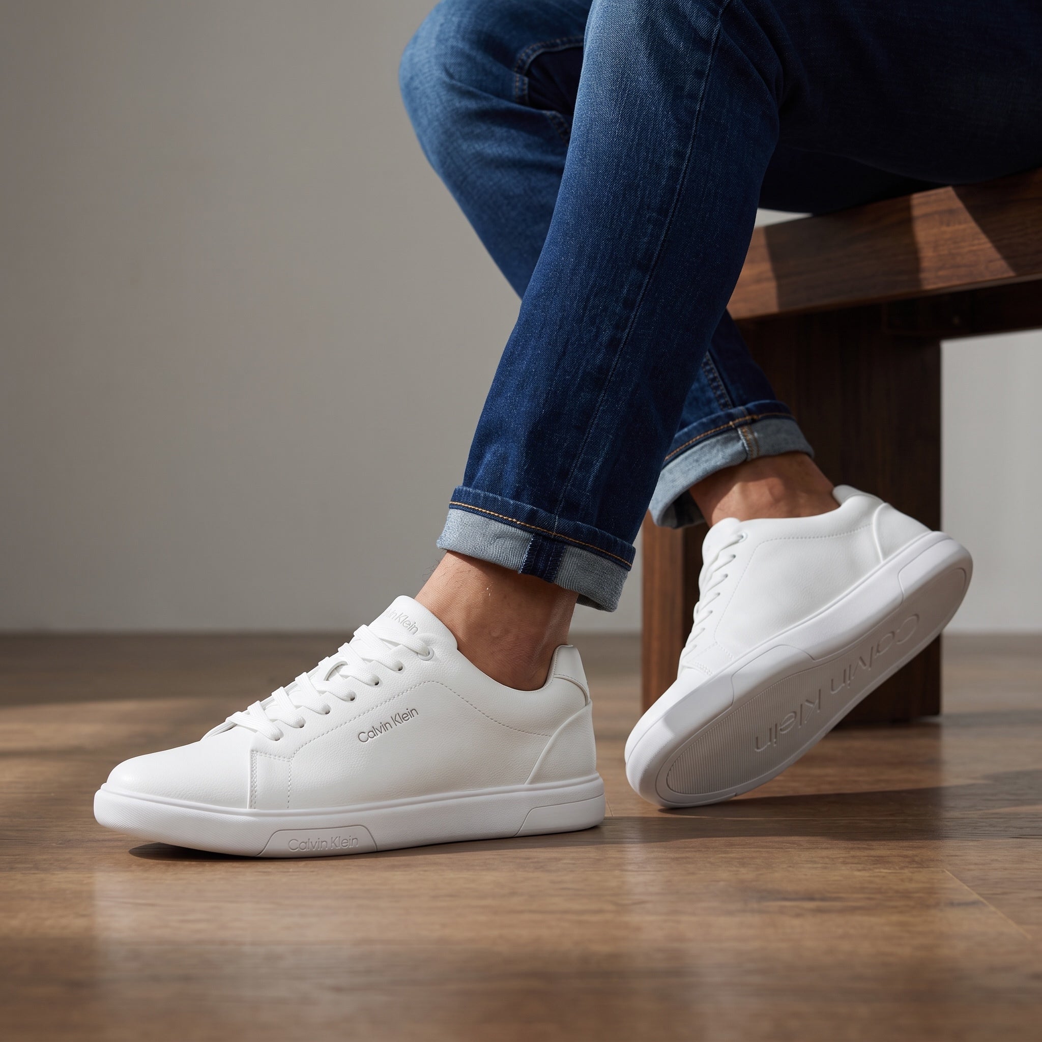 Calvin Klein white low-top sneakers with rubber sole and subtle branding