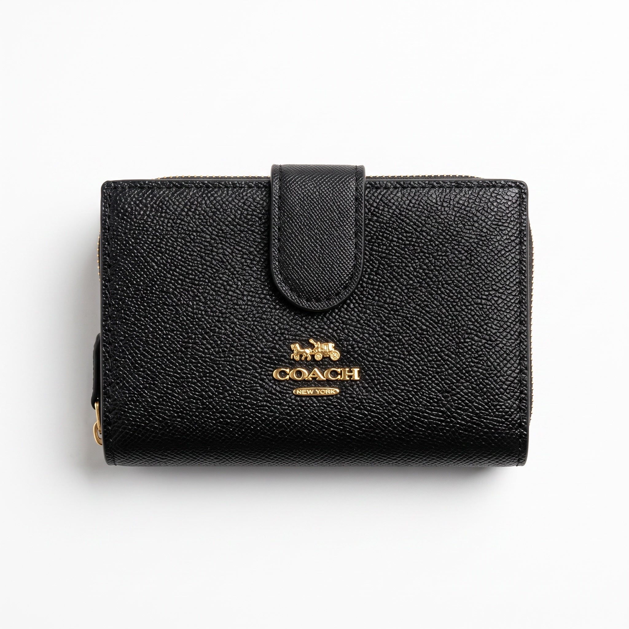 Coach compact black pebbled wallet with gold logo and zip-around edge