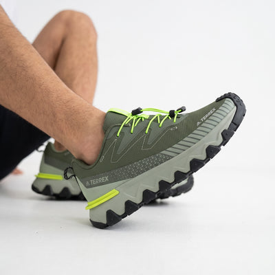Adidas Terrex olive green trail sneaker with neon laces and rugged lug sole