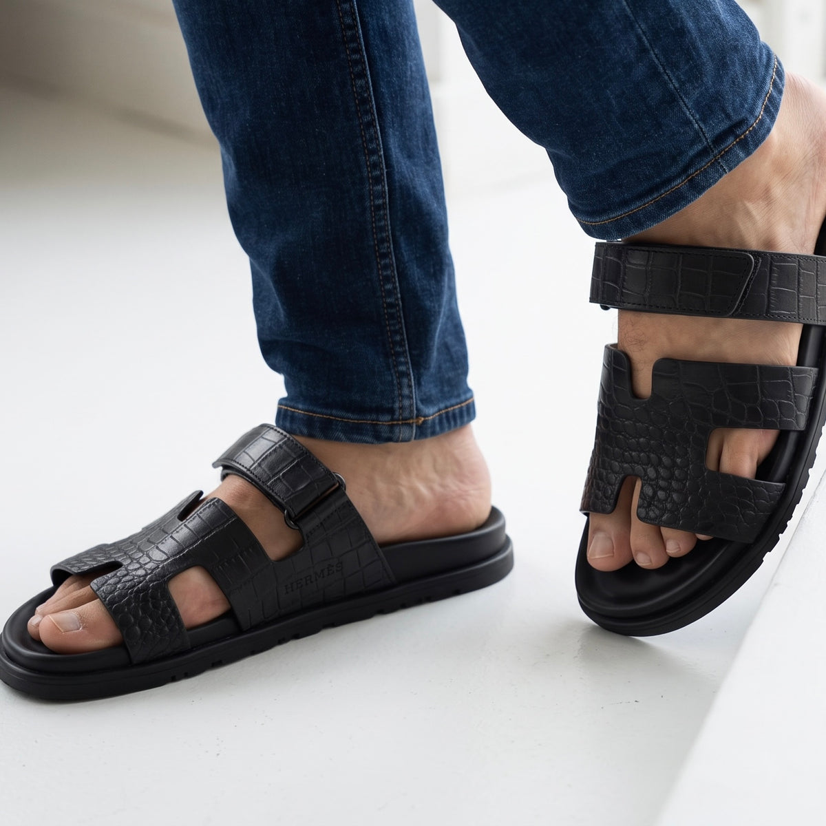Hermès black croc-embossed men's slide sandal with adjustable ankle strap and chunky sole