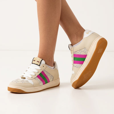 Beige Gucci low-top sneaker with pink and green web stripe and gum sole