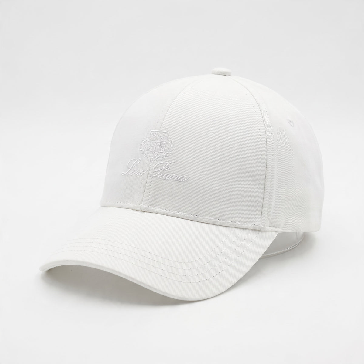 White Loro Piana embroidered baseball cap, close-up