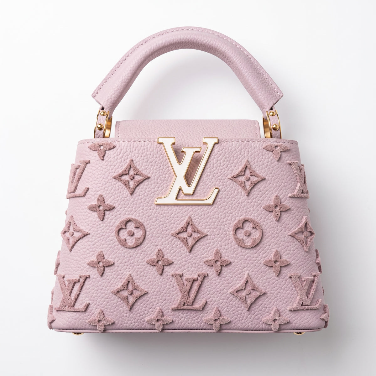 Pink Louis Vuitton Capucines top-handle bag with raised monogram and gold LV plaque