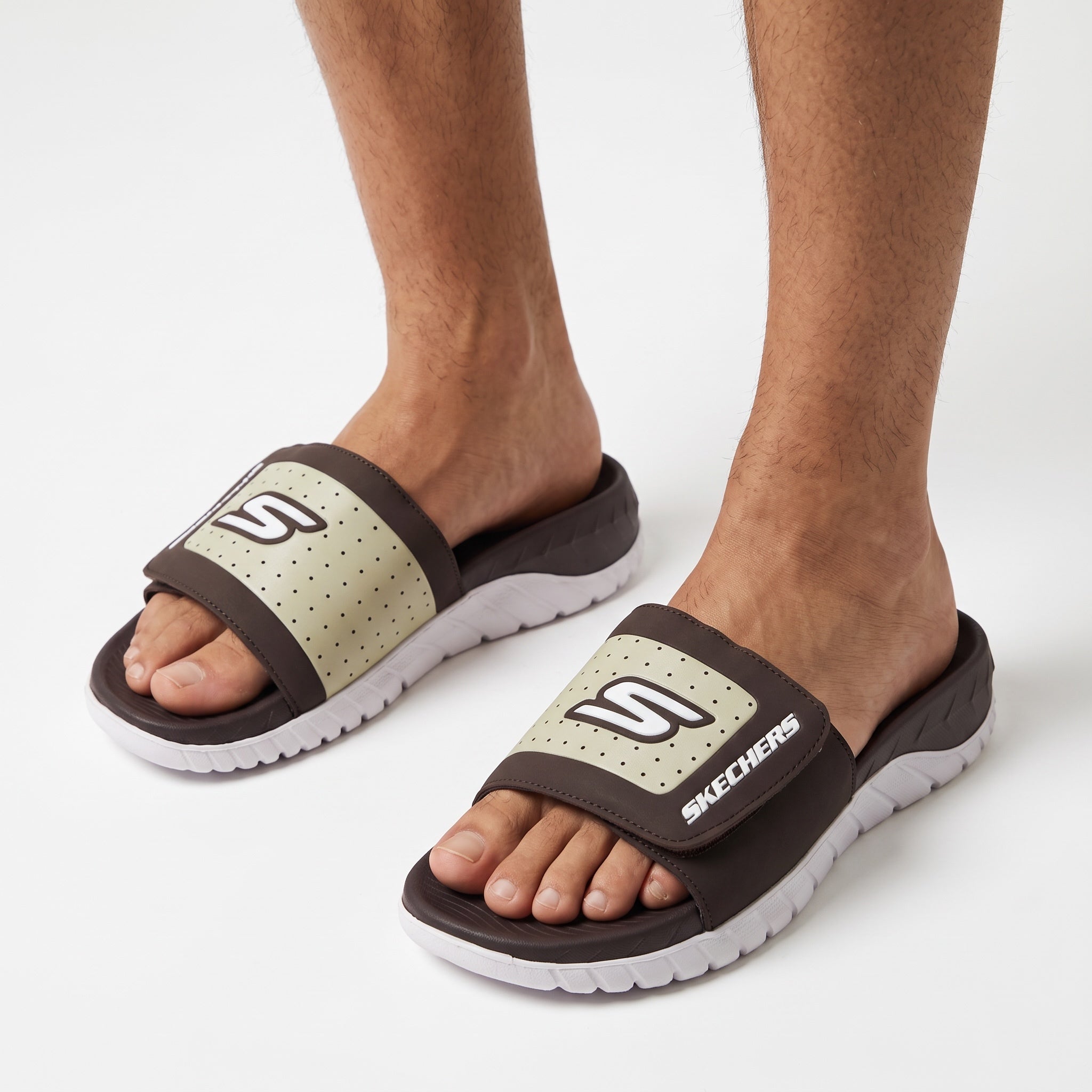 Skechers brown and pale green slide with white chunky sole