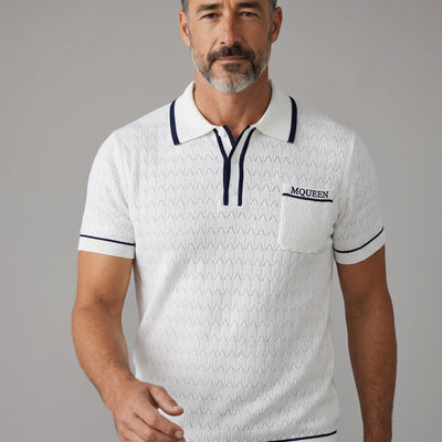 White Alexander McQueen short-sleeve knit polo with navy trim and chest pocket embroidered MCQUEEN