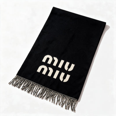Black Miu Miu scarf with cream logo lettering and braided fringe