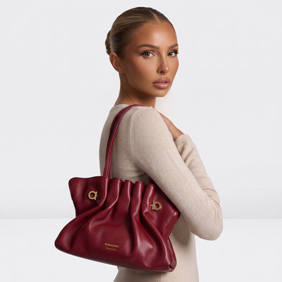 Ferragamo burgundy ruched tote with gold Gancini hardware