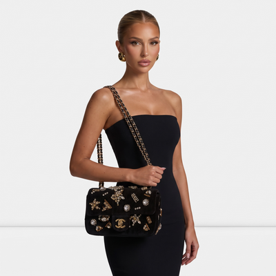Chanel black velvet flap bag with jeweled embellishments and gold chain strap