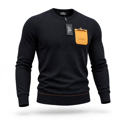 Black Hermès crewneck sweater with orange chest pocket and gold clasp