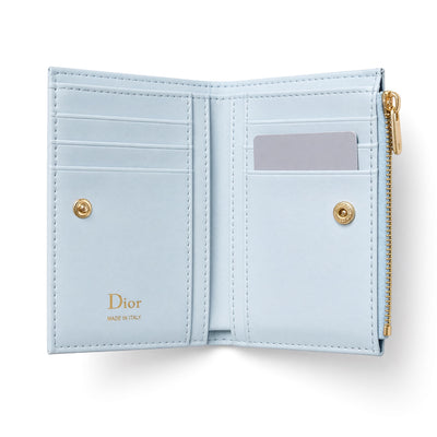 Light blue Dior compact quilted wallet with bow charm and zip pocket