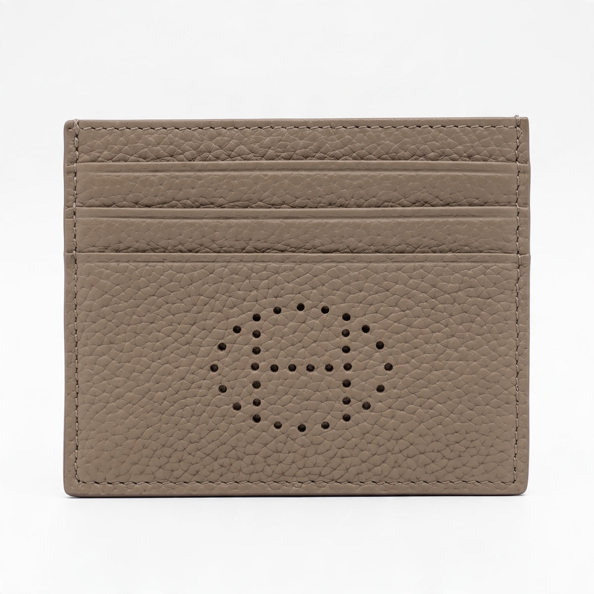 Taupe pebbled leather Hermès card holder with perforated H and horizontal card slots