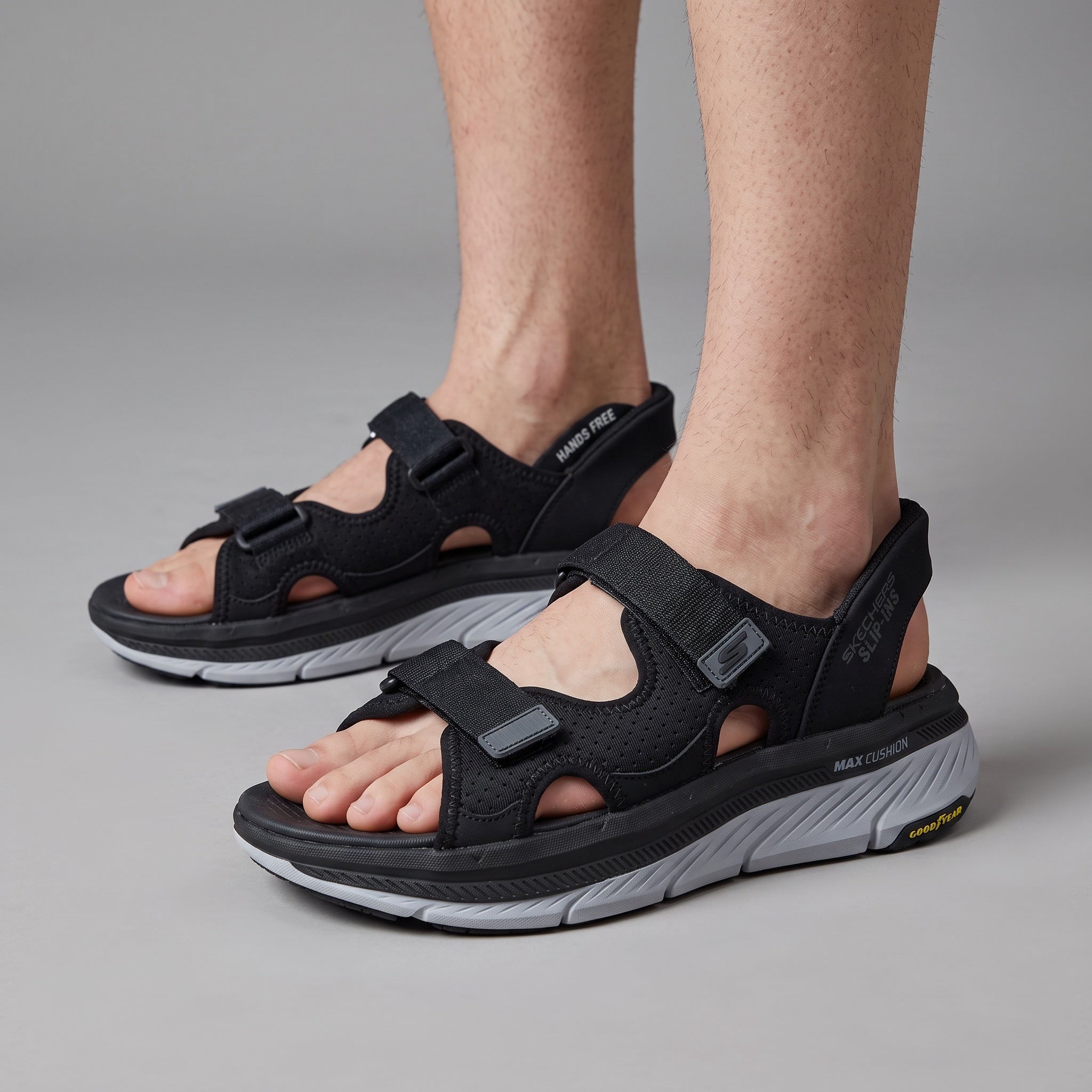 black Skechers men's sport sandal with thick white midsole and velcro straps