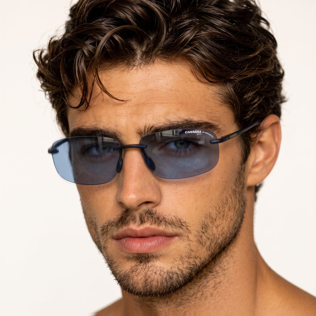 Carrera rimless sunglasses with navy blue lenses and slim metal temples