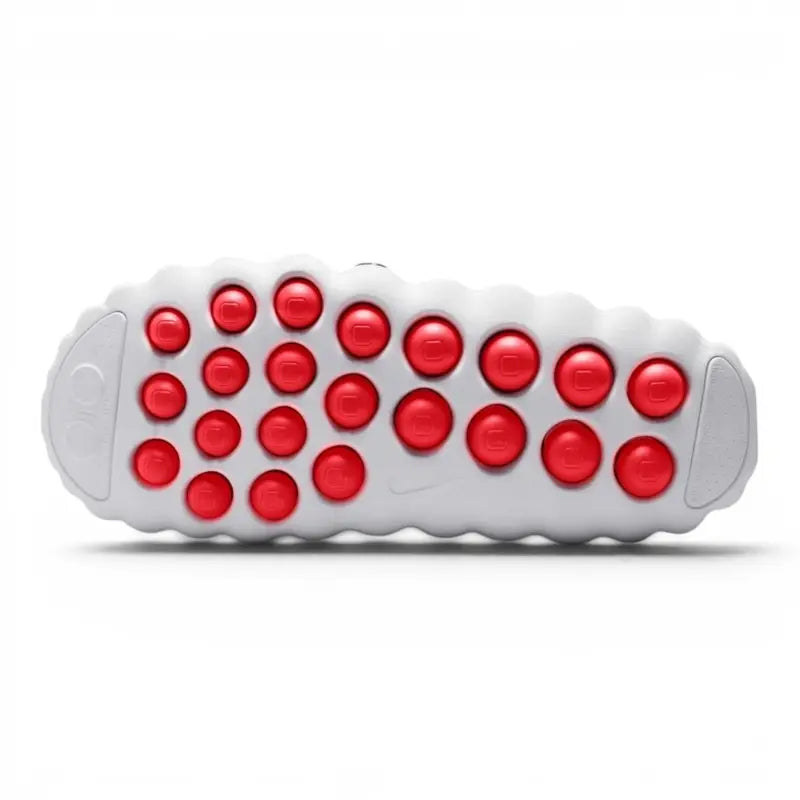 White Nike slip-on clog with perforated upper and red circular outsole pods