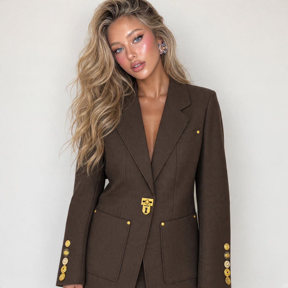Chocolate brown tailored blazer with gold lock clasp and gold buttons on sleeves