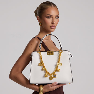 White Fendi top-handle shoulder bag with gold chain charms and logo strap