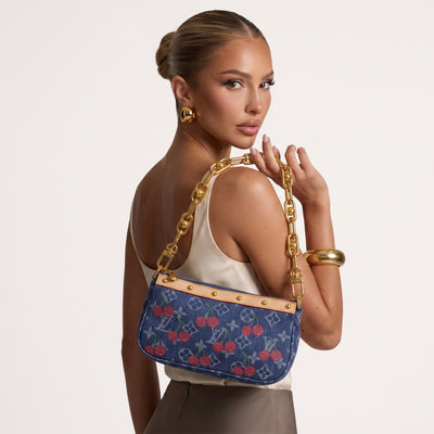 Blue denim Louis Vuitton shoulder bag with cherry print, tan trim and gold chain strap