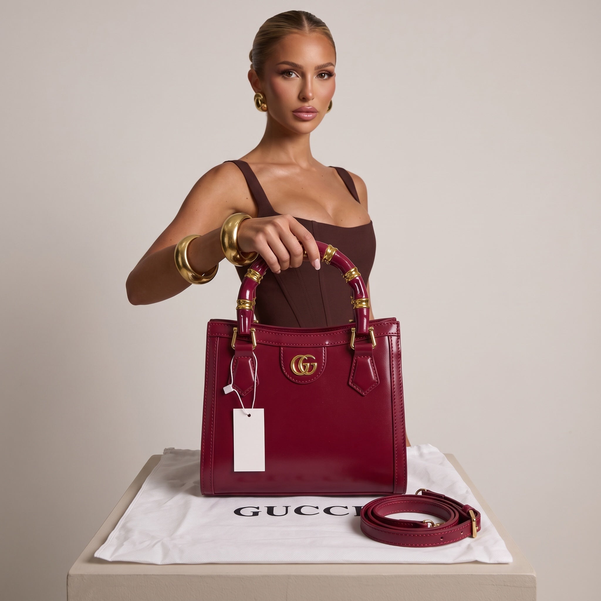 Gucci small burgundy tote with bamboo-style lacquered handles and gold GG logo