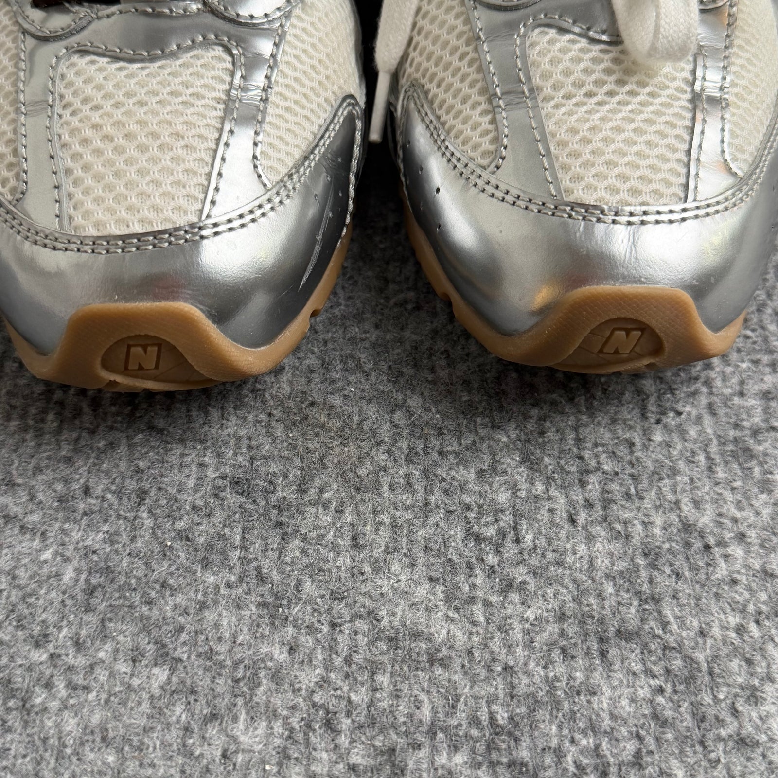 New Balance 328 silver and white trainer with gum sole and mesh upper