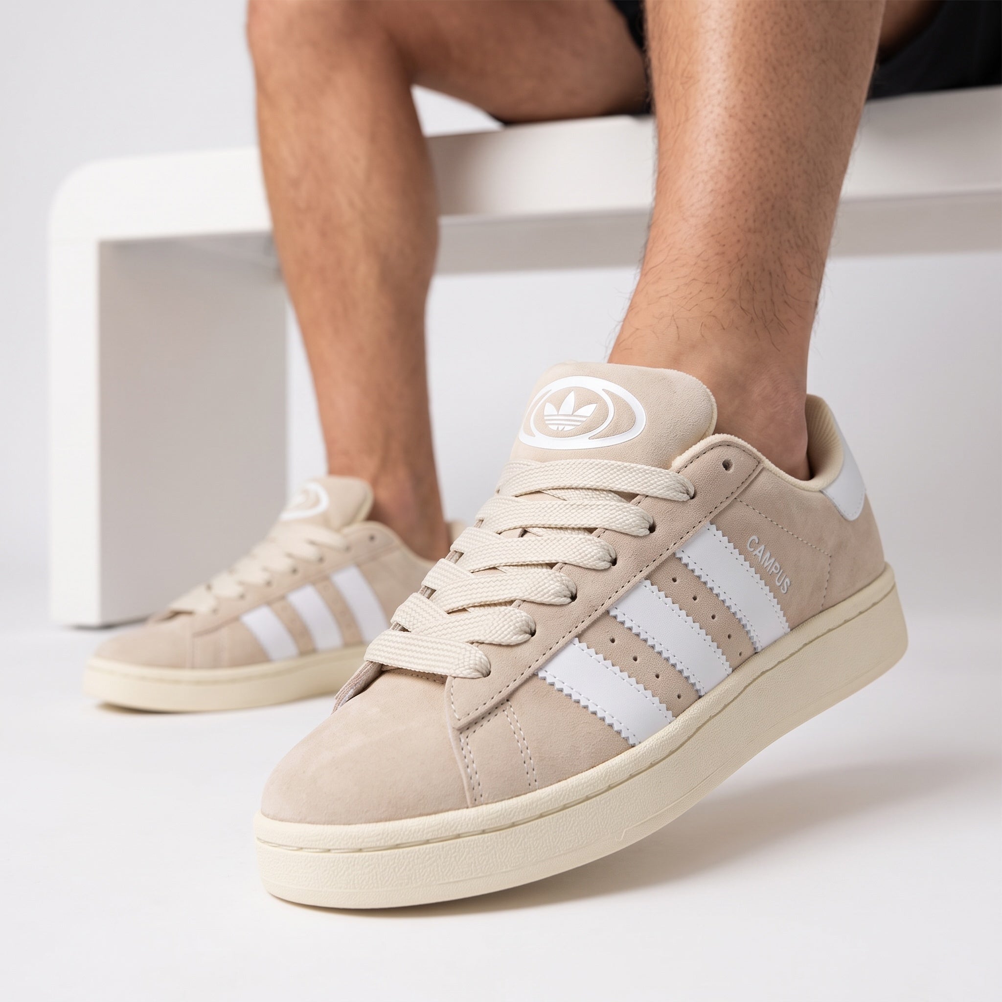 Adidas Campus beige sneaker with white stripes close-up