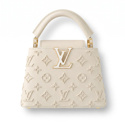 Cream Louis Vuitton top-handle bag with LV logo and monogram appliqué