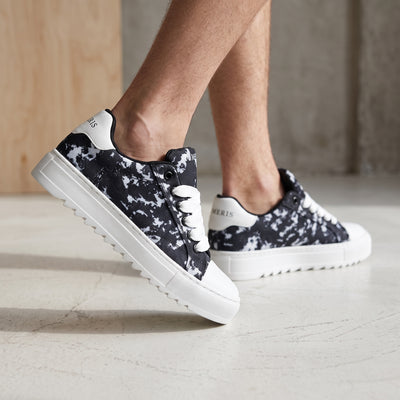 Numeris black and white marble low-top sneakers with chunky white platform sole