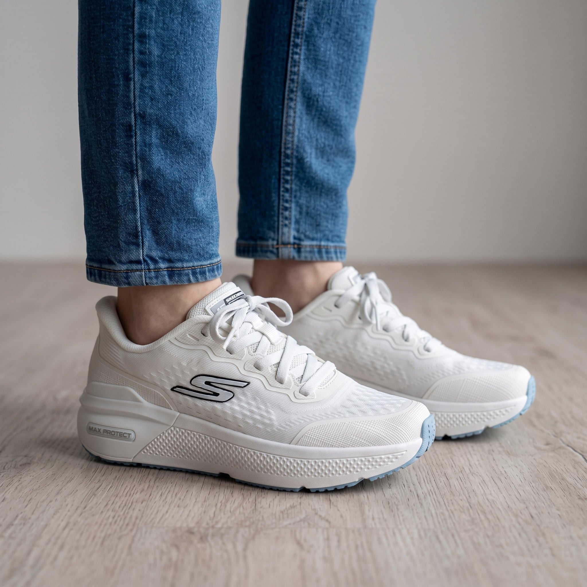 White Skechers Max Cushioning sneakers with thick sole and textured upper
