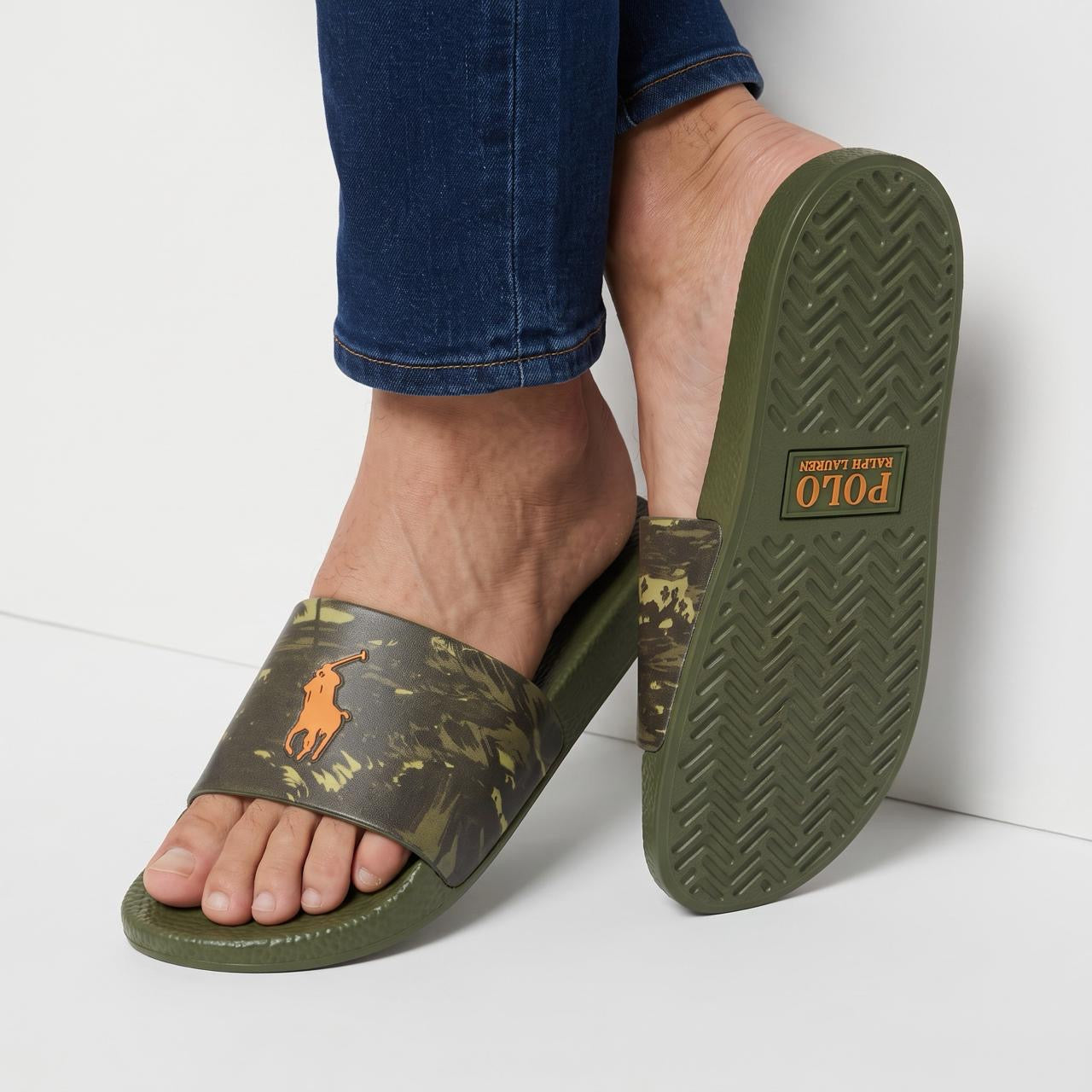 Polo Ralph Lauren olive camo slide with orange pony logo on foot