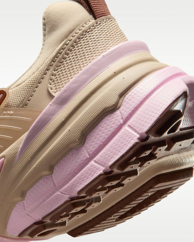 Nike tan and pink chunky sneaker with mesh upper and metallic overlays
