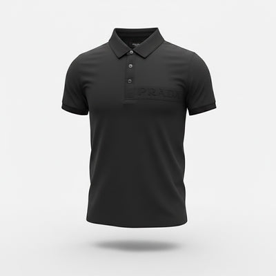 MASTERPIECE black stretch fabric polo shirt with tonal embossed Prada logo on chest, classic collar, and button placket.