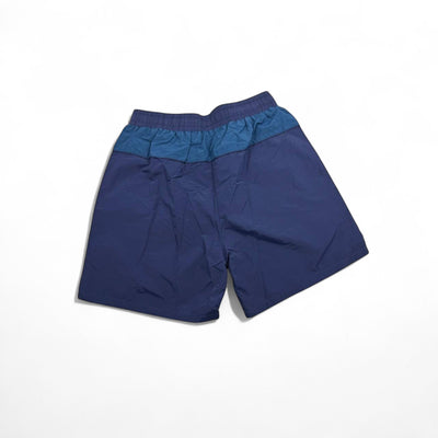 MASTERPIECE blue and dark teal panel swim shorts with yellow drawstring and embroidered logo.