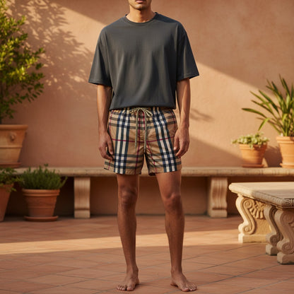 MASTERPIECE beige checkered swim shorts with drawstring and cargo pocket. Classic check pattern.