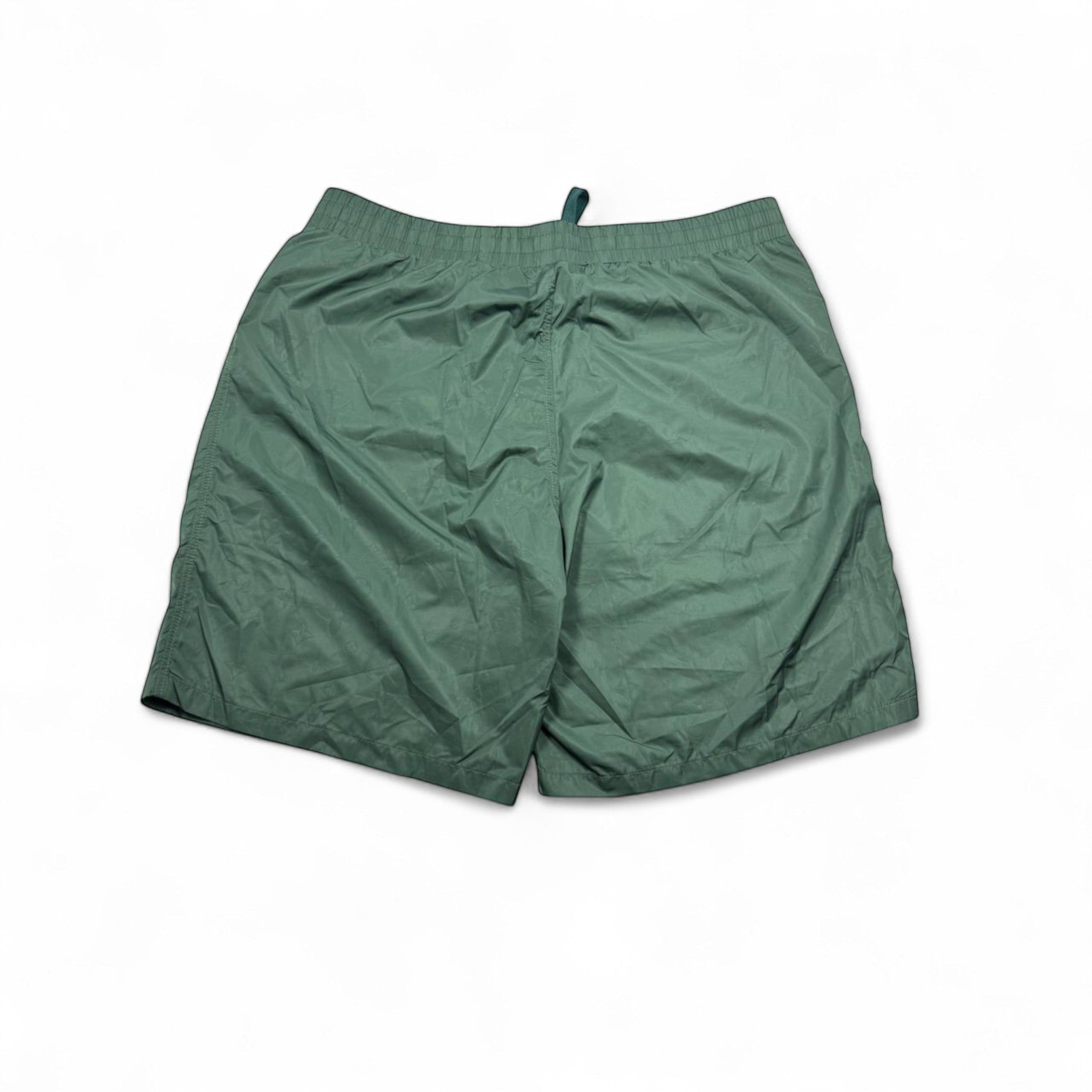 MASTERPIECE green technical fabric swim shorts with tonal monogram pattern and elastic waistband.