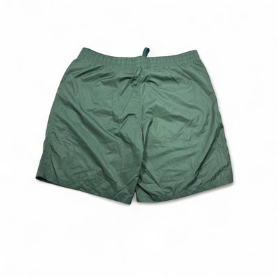 MASTERPIECE green technical fabric swim shorts with tonal monogram pattern and elastic waistband.
