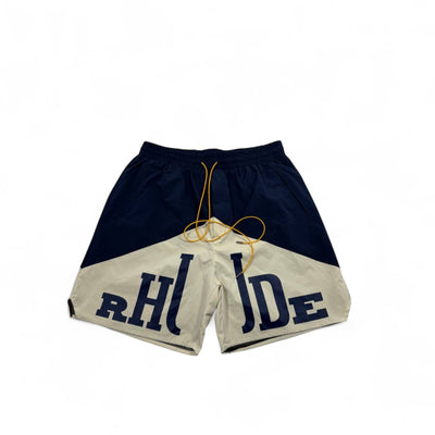 MASTERPIECE navy and cream panel logo swim shorts with yellow drawstring. Lightweight, fast-drying summer essential.