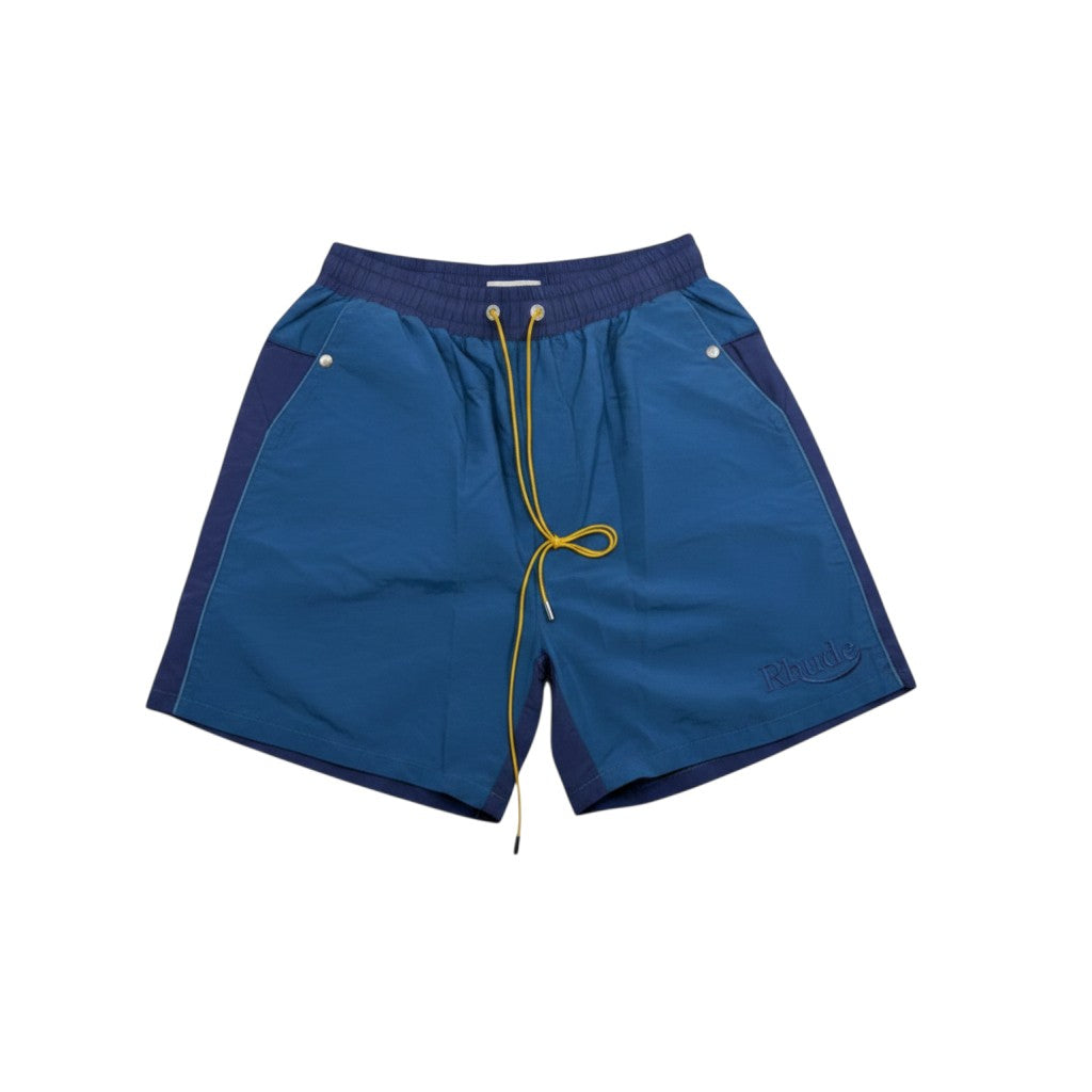 MASTERPIECE Rhude blue panel swim shorts with yellow drawstring and embroidered logo. Lightweight, quick-drying fabric with mesh lining.