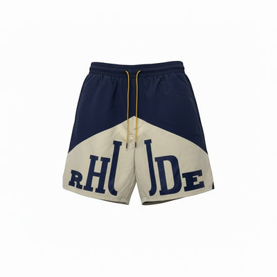 MASTERPIECE navy and cream Rhude panel logo swim shorts with yellow drawstring. Lightweight, fast-drying material.