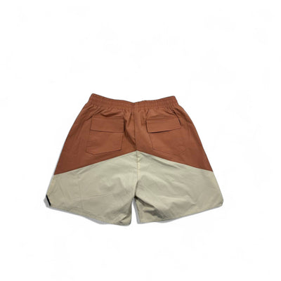 MASTERPIECE Rhude panel swim shorts in rust brown and cream, featuring two back pockets and a signature yellow drawstring.