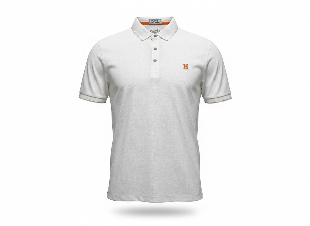 MASTERPIECE white textured polo shirt with orange embroidered H logo and contrast stitching on collar and cuffs.