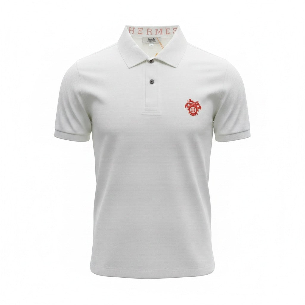 MASTERPIECE white polo shirt with red embroidered crest logo on chest and signature Hermès collar detail. Premium breathable fabric.