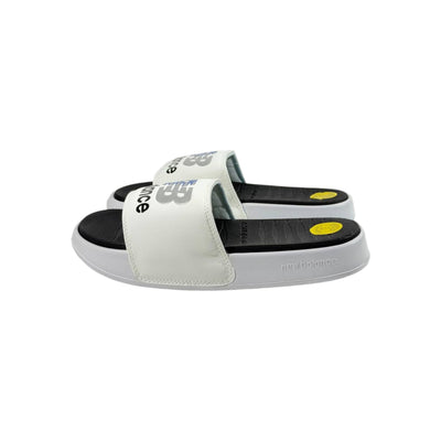 ⚡ New Balance Black & White Comfort Slides – Clean. Classic. Powerful. 🤍🖤 - MASTERPIECE