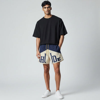 Rhude Panel Logo Swim Shorts — Navy & Cream - MASTERPIECE